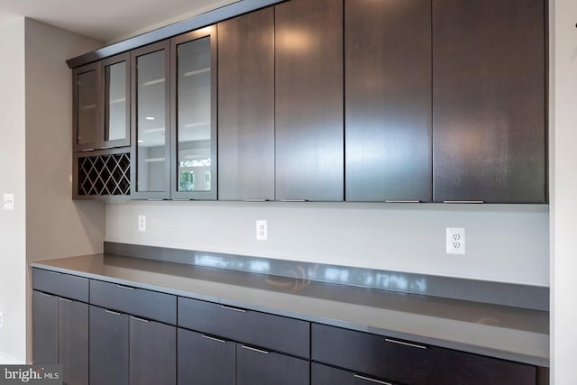 kitchen featuring dark brown cabinetry