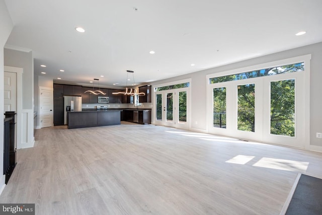 unfurnished living room featuring light hardwood / wood-style flooring