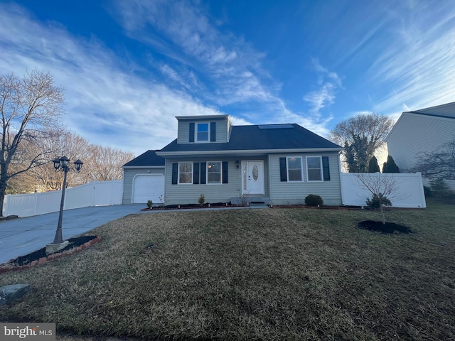 view of front of house featuring a garage and a front yard