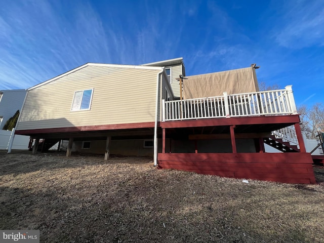 view of property exterior featuring a deck