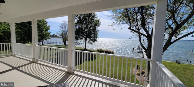 balcony featuring a water view