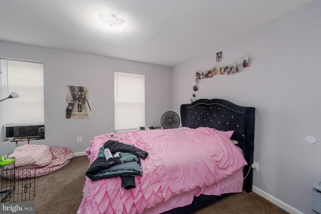 bedroom featuring cooling unit and carpet