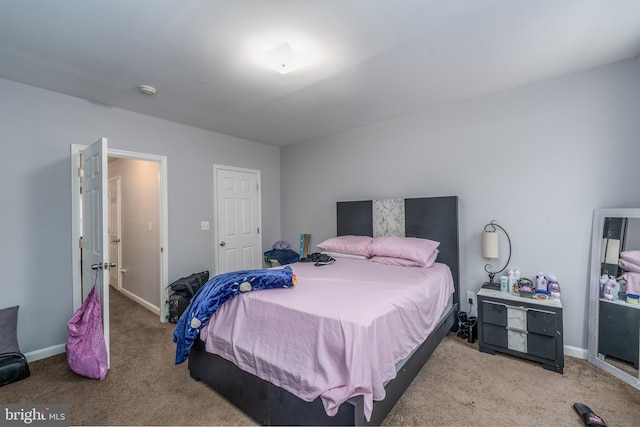bedroom with light colored carpet