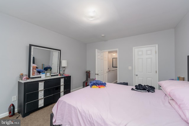 bedroom featuring light carpet