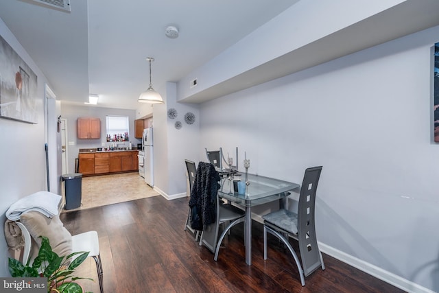 dining room featuring dark hardwood / wood-style floors