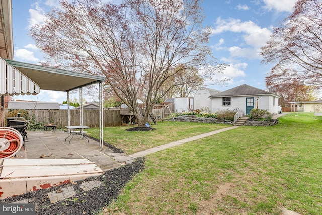 view of yard with a patio area and fence private yard
