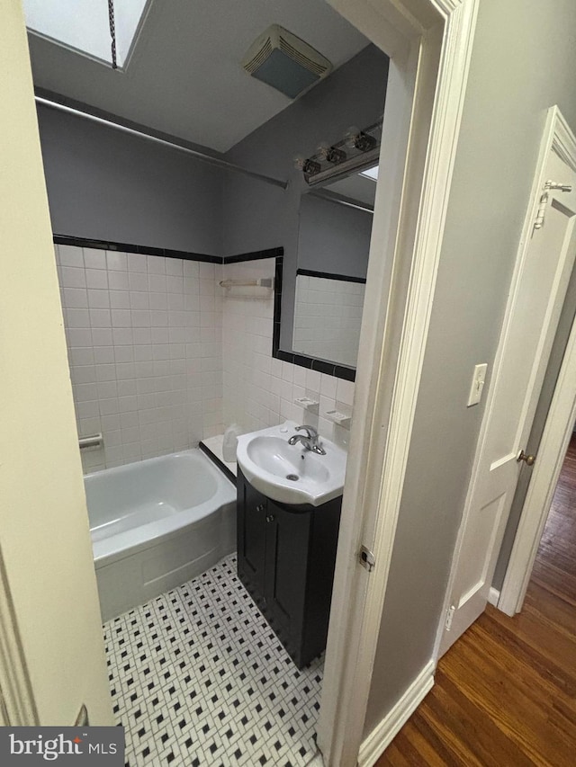 bathroom featuring hardwood / wood-style flooring and vanity