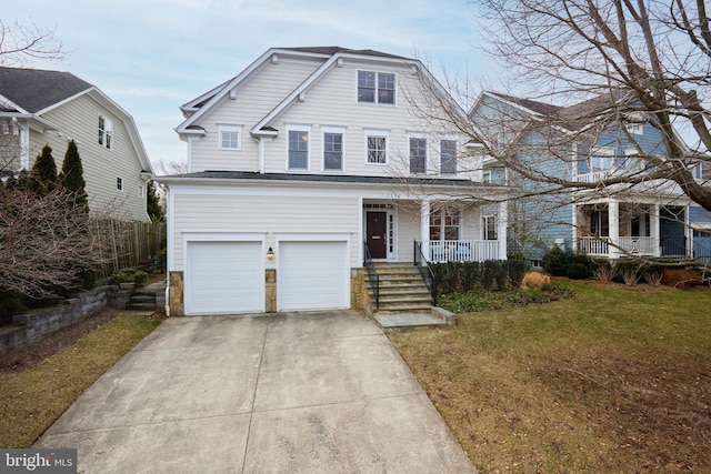 front facade featuring a front lawn, a porch, and a garage