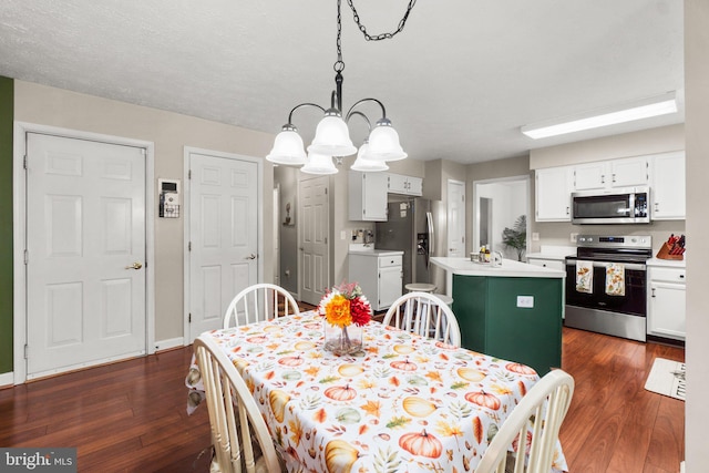 dining area featuring dark wood-type flooring