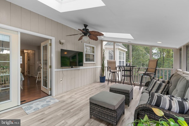 exterior space featuring a skylight and ceiling fan