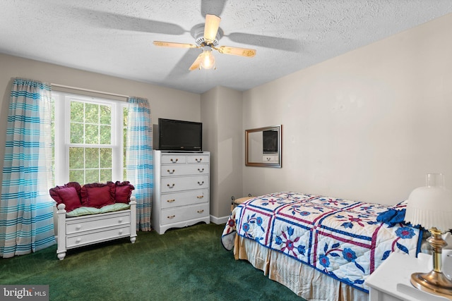 carpeted bedroom featuring ceiling fan and a textured ceiling