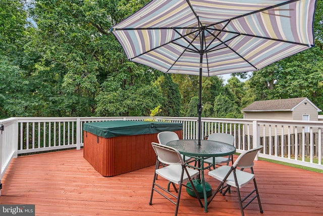 wooden terrace with a hot tub