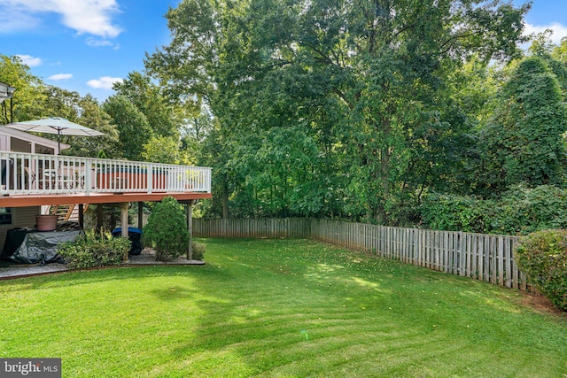 view of yard with a wooden deck