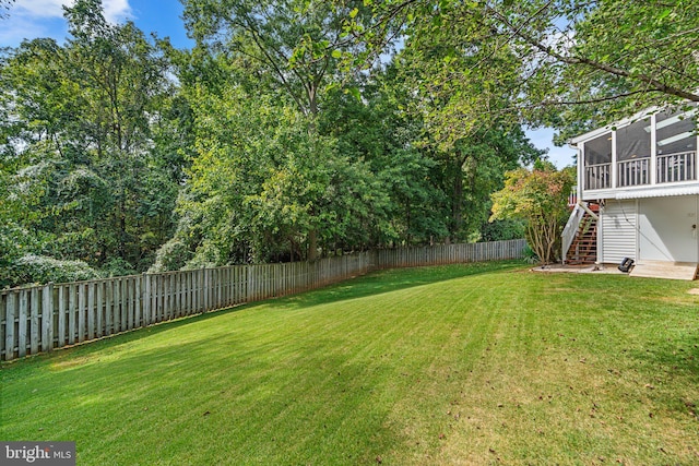 view of yard featuring a sunroom