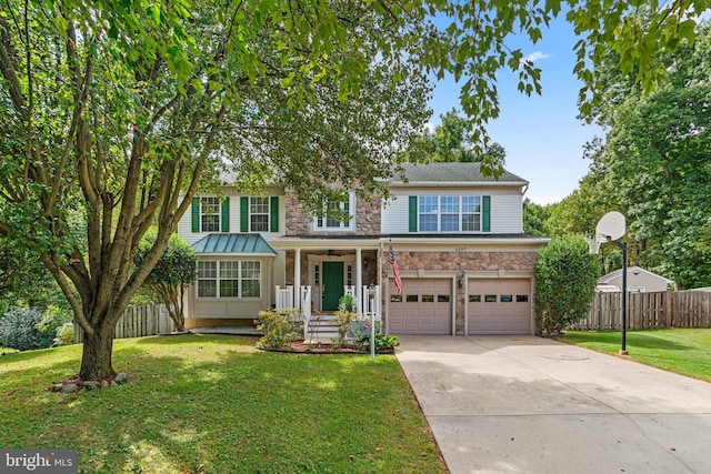 view of front of property with a garage and a front lawn