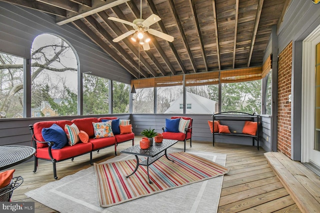 sunroom featuring wooden ceiling, ceiling fan, and vaulted ceiling with beams