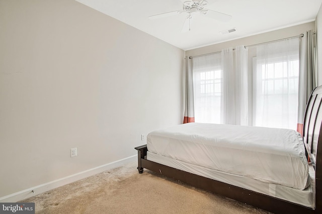 bedroom featuring carpet, visible vents, ceiling fan, and baseboards