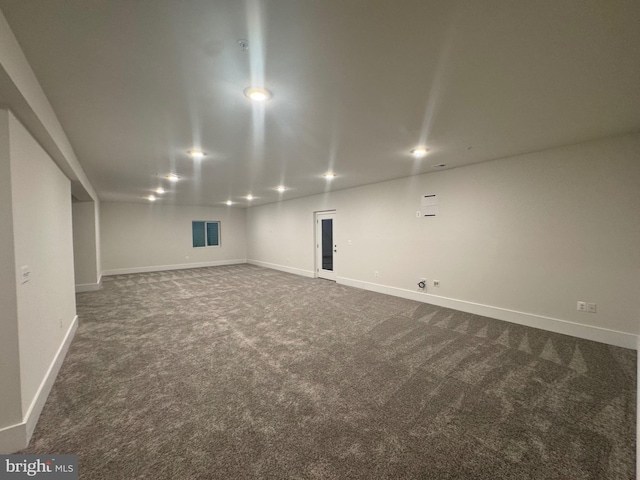 finished below grade area with carpet floors, recessed lighting, visible vents, and baseboards