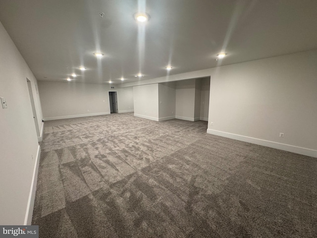 finished basement with carpet floors, recessed lighting, and baseboards