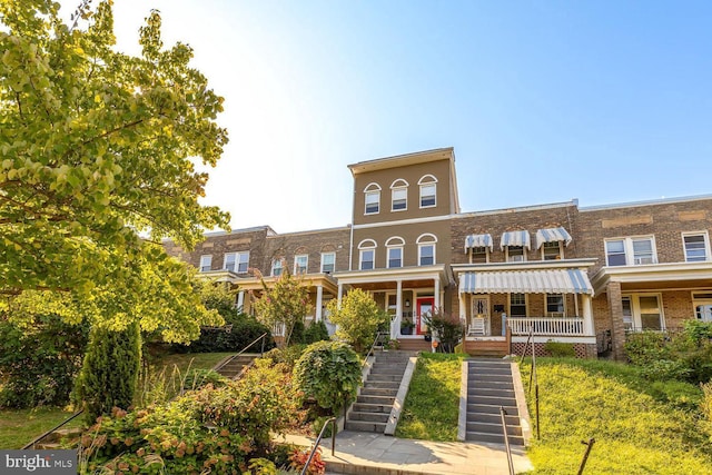 exterior space featuring a front yard and covered porch