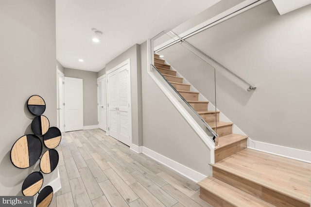 staircase featuring hardwood / wood-style floors