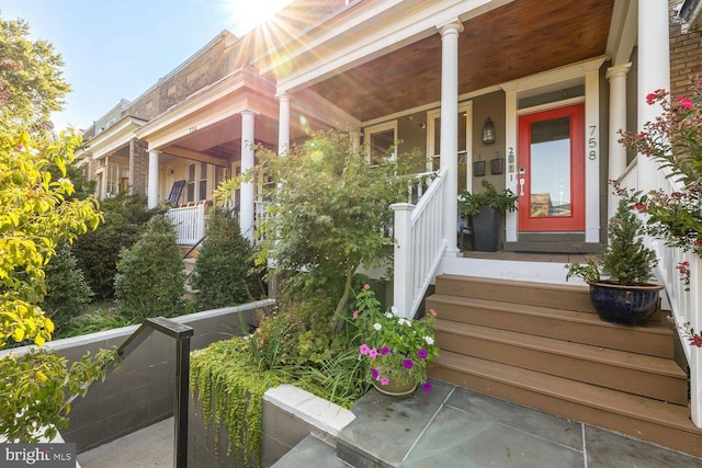 entrance to property featuring a porch