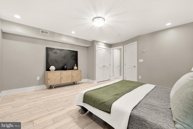 bedroom with light hardwood / wood-style flooring