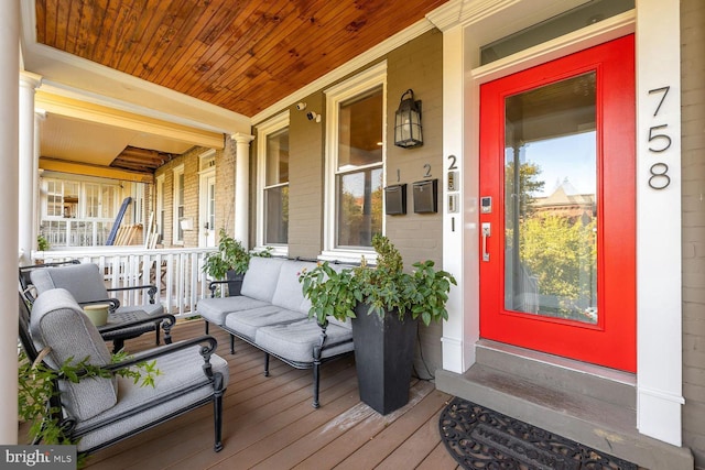 entrance to property featuring a porch