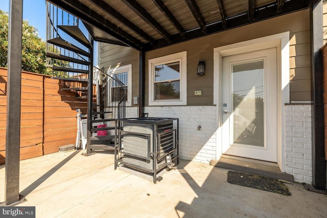 entrance to property featuring a patio