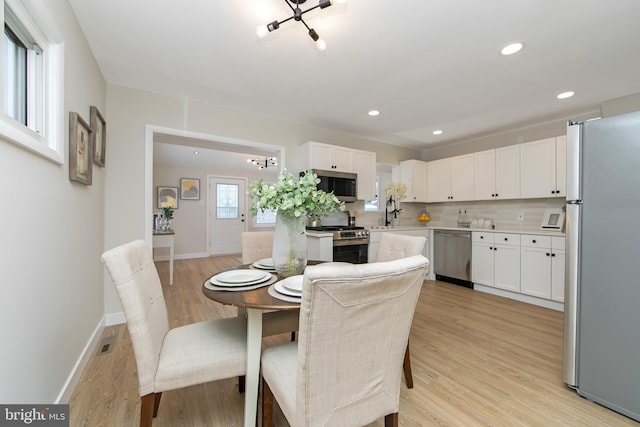 dining space featuring light hardwood / wood-style floors