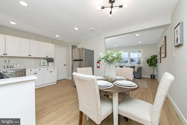 dining room featuring light hardwood / wood-style flooring