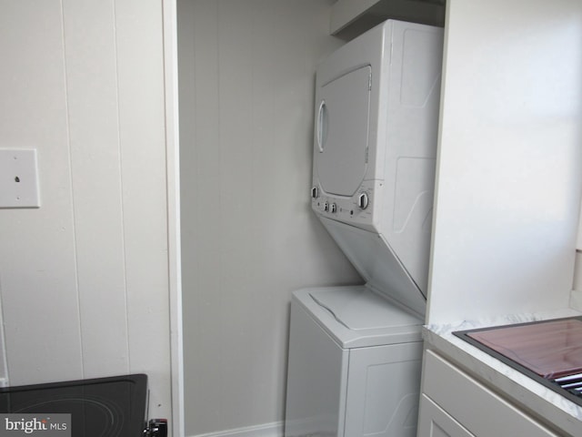 laundry area featuring laundry area and stacked washer / dryer