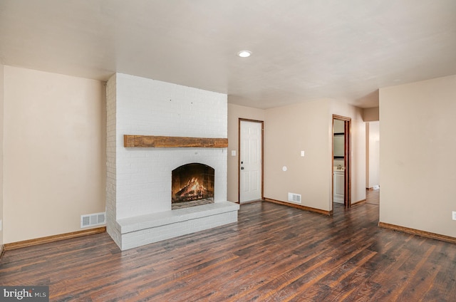 unfurnished living room with a fireplace and dark hardwood / wood-style flooring