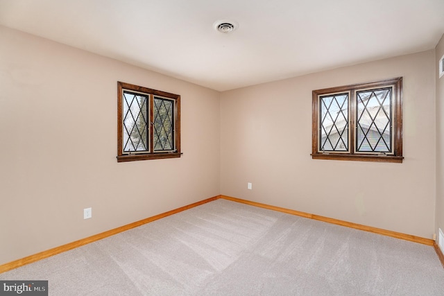 empty room with carpet flooring