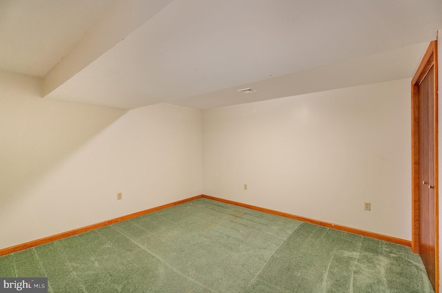 bonus room featuring lofted ceiling and carpet