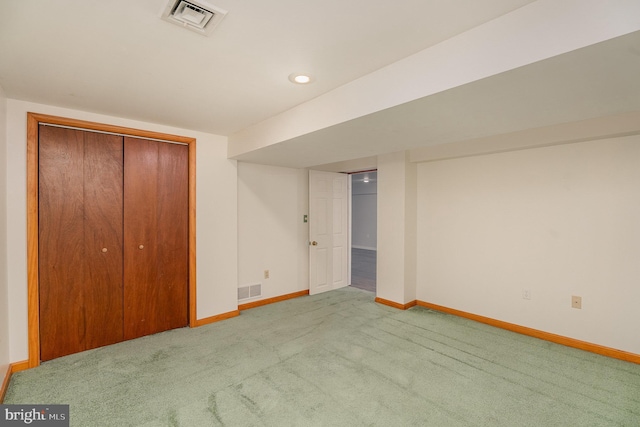 unfurnished bedroom with carpet flooring and a closet