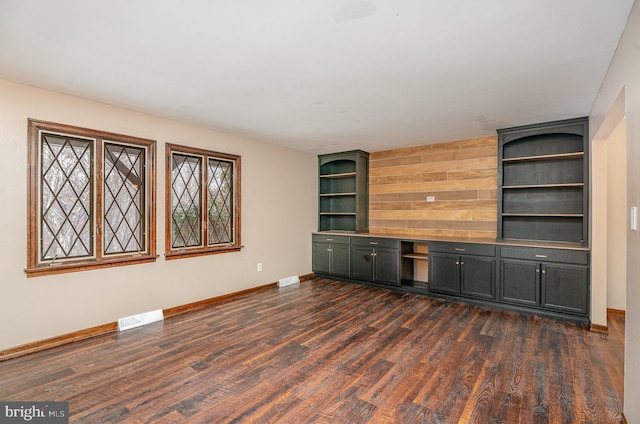 unfurnished office with dark hardwood / wood-style flooring