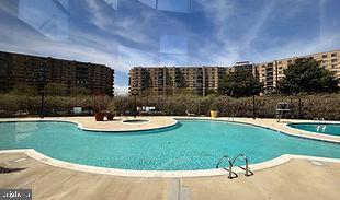 pool with a patio and a view of city