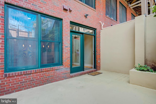 doorway to property featuring a patio