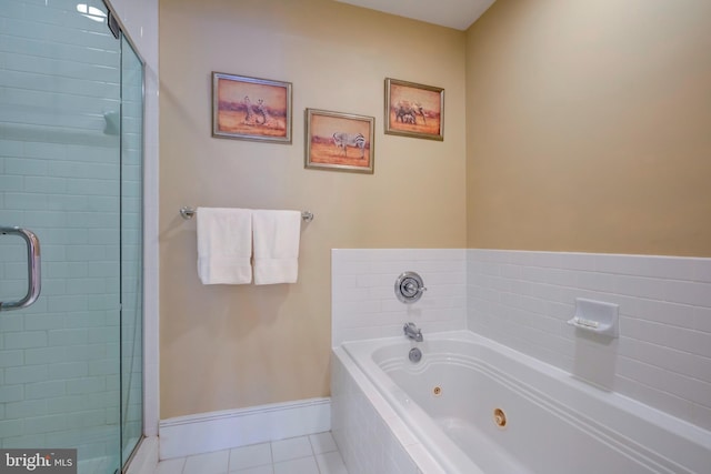 bathroom featuring tile patterned flooring and independent shower and bath