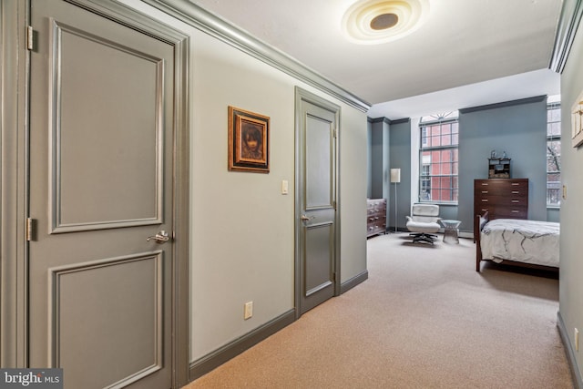 carpeted bedroom featuring baseboards