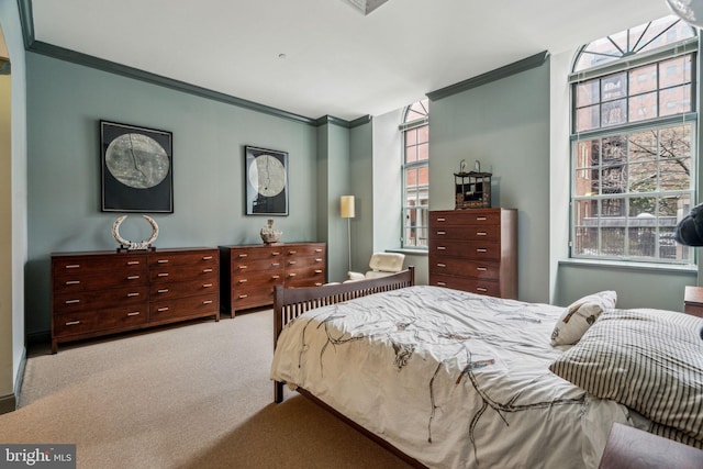 carpeted bedroom featuring ornamental molding