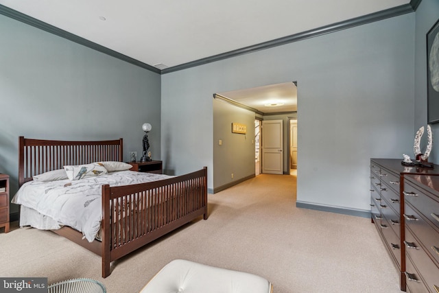 bedroom featuring light colored carpet, crown molding, and baseboards