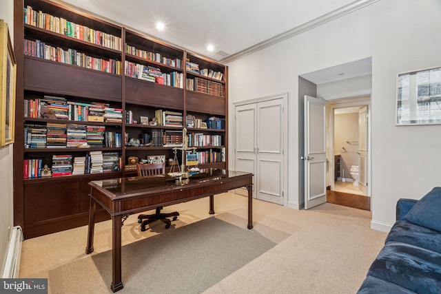 carpeted office space featuring a baseboard radiator, crown molding, and baseboards