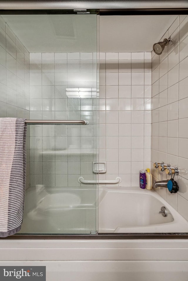 bathroom featuring enclosed tub / shower combo