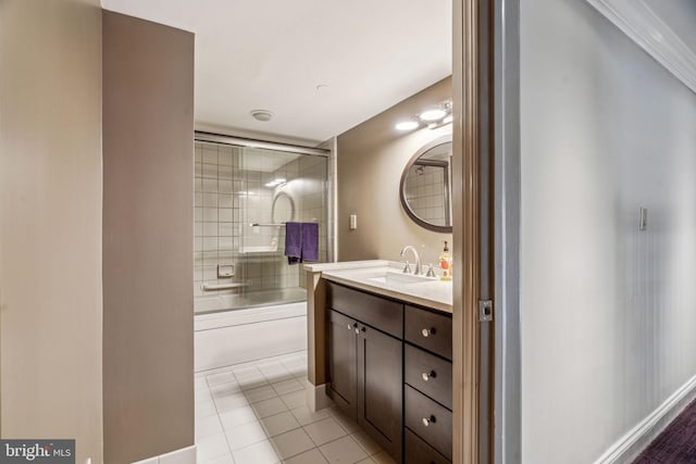 full bathroom featuring shower / bath combination with glass door, vanity, and tile patterned floors