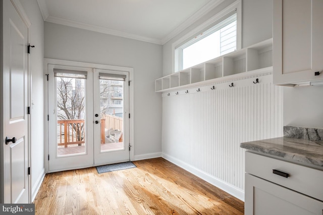 mudroom featuring ornamental molding, french doors, and light hardwood / wood-style flooring