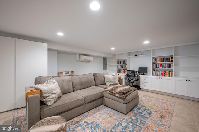 living room featuring built in features, electric panel, and a wall mounted air conditioner