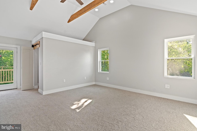 unfurnished room with ceiling fan, light carpet, and high vaulted ceiling