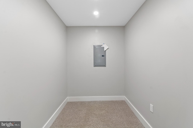 carpeted empty room featuring electric panel